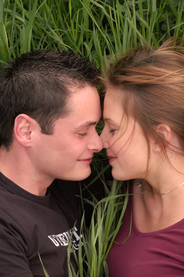 young-couple-kissing-in-the-gras-10-1311084-639x960